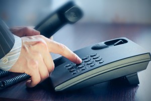 The businessman calling by phone.